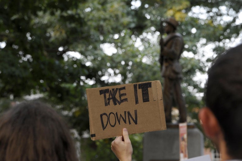 Demonstrators rally for the removal of Confederate statue Silent Sam.